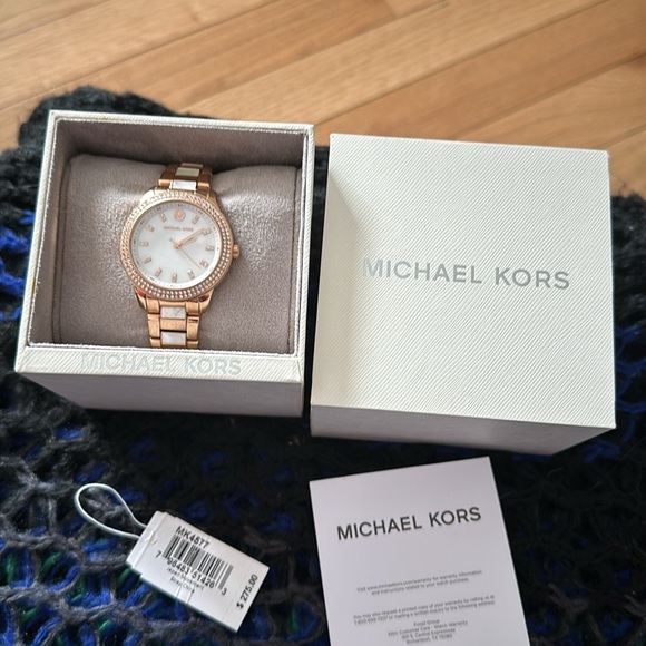 Michael Kors watch. Gold and mother of pearl color. Comes in original box. - Picture 3 of 4